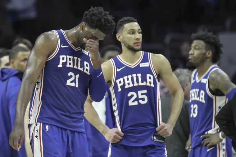Sixers' Joel Embiid, Ben Simmons and Robert Covington during a late timeout in the loss to the Pacers.