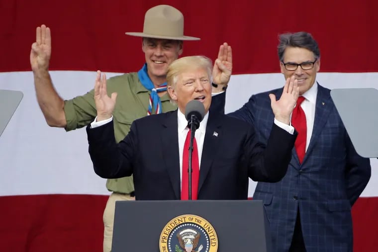 President DonaldTrump, front left, gestures as former boys scouts, Ryan Zinke, left, Secretary of Interior, Rick Perry, Secretary of Energy, right, at the 2017 National Boy Scout Jamboree at the Summit in Glen Jean,W. Va., Monday, July 24, 2017.