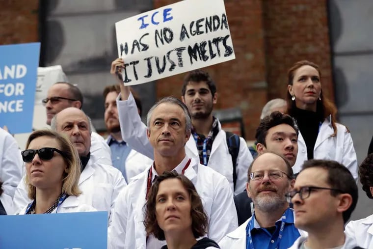Scientists hold signs during a rally in conjunction with the American Geophysical Union's December meeting in San Francisco.