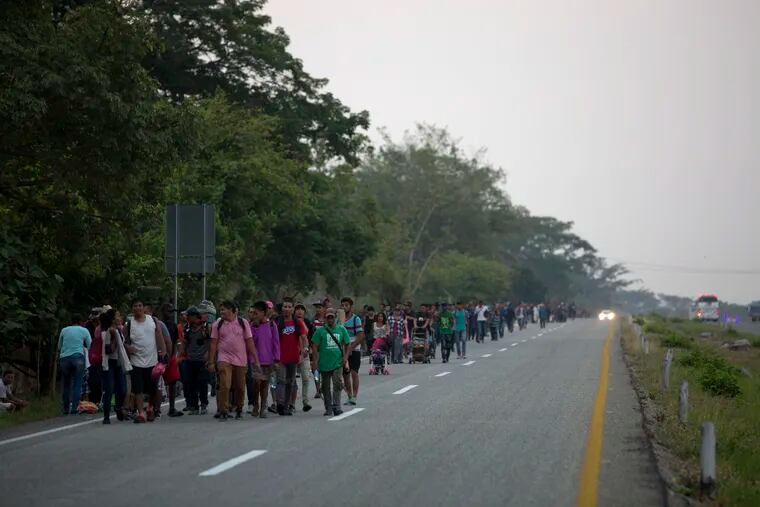 Central American migrants traveling in a caravan to the U.S. border walk on a road in Pijijiapan, Mexico, Monday, April 22, 2019. The outpouring of aid that once greeted Central American migrants as they trekked in caravans through southern Mexico has been drying up, so this group is hungrier, advancing slowly or not at all, and hounded by unhelpful local officials. (AP Photo/Moises Castillo)