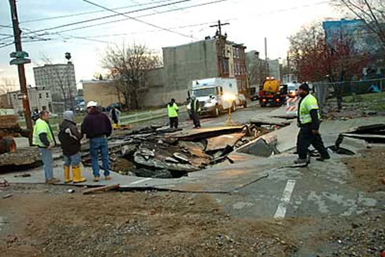 A huge hole in the intersection of Susquehanna and 4th Street is a result of an overnight water break. December 9, 2008  (Sarah J. Glover / Staff Photographer)
