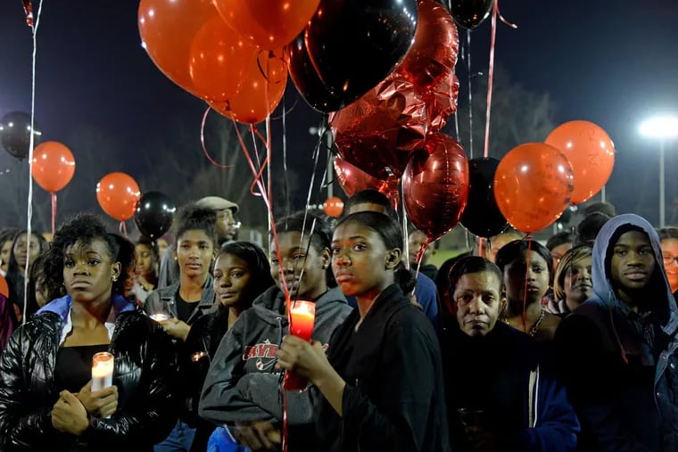 Mourners honor 15-year-old Xavier Stern with a candlelight vigil. Stern, who left home Nov. 22, was found dead Friday.