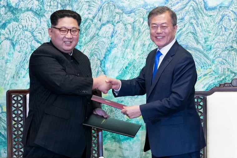 North Korean leader Kim Jong Un, left, and South Korean President Moon Jae-in shake hands after signing on a joint statement at the border village of Panmunjom in the Demilitarized Zone, South Korea.