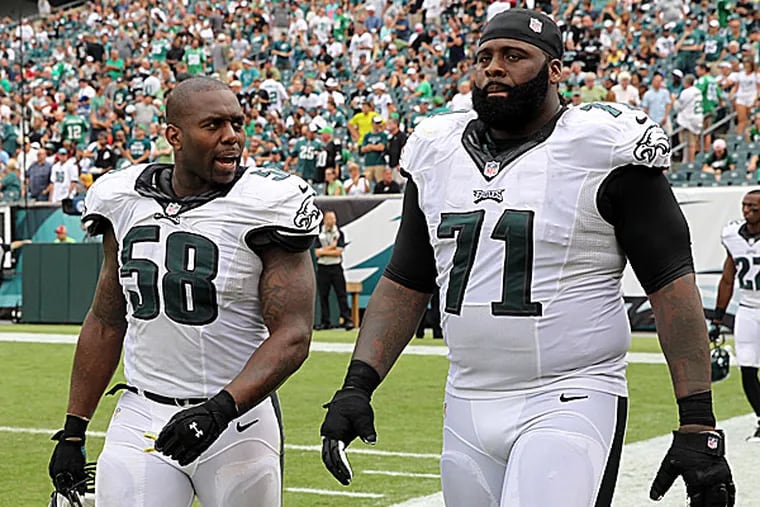 Eagles linebacker Trent Cole and left tackle Jason Peters. (Yong Kim/Staff Photographer)