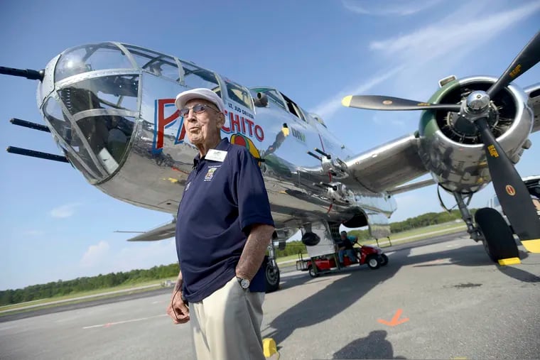 FILE - In this April 16, 2013, file photo, Doolittle Raider Lt. Col. Dick Cole stands in front of a B-25 at the Destin Airport in Destin, Fla., before a flight as part of the Doolittle Raider 71st Anniversary Reunion. Retired Lt. Col. Richard "Dick" Cole, the last of the 80 Doolittle Tokyo Raiders who carried out the daring U.S. attack on Japan during World War II, has died at a military hospital in Texas. He was 103. A spokesman says Cole died Tuesday, April 9, 2019, at Brooke Army Medical Center in San Antonio, Texas. (Nick Tomecek / Northwest Florida Daily News via AP, File)
