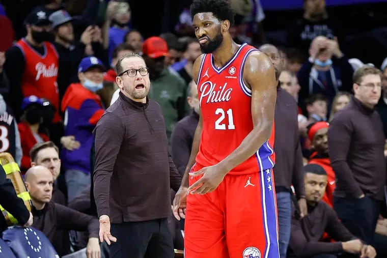 Sixers center Joel Embiid walks away from Toronto Raptors coach Nick Nurse late in the fourth quarter during Game 2 of the Eastern Conference first-round playoff game on Monday.