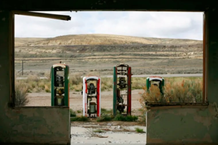 An abandoned gas station off Route 30in Wyoming, along the Murdocks&#0039; path. In 1908, when Murdock became the first to drive his family coast- to-coast, gas averaged about 25 cents.