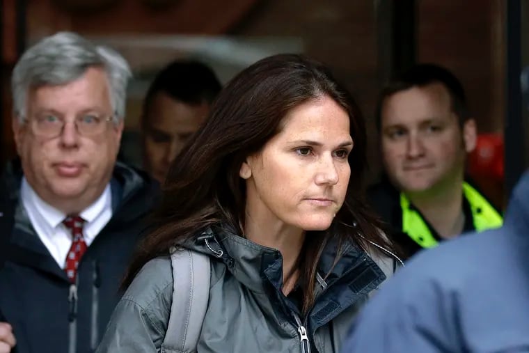 Former University of Southern California soccer coach Laura Janke departs federal court, Tuesday, May 14, 2019, in Boston, where she pleaded guilty to charges in a nationwide college admissions bribery scandal. (AP Photo/Steven Senne)