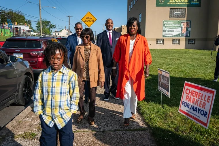 Cherelle Parker arrives at her polling place Tuesday with her son, Langston Mullins, 10; former Councilmember Marion Tasco; Ishaq Samai, of the Philadelphia Anti-Drug/Anti-Violence Network; and U.S. Rep. Dwight Evans.
