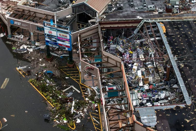 Debris covers the interior of a building with a destroyed roof at the Palma Real Shopping Center in Humacao on Sept. 22, two days after Hurricane Maria devastated large areas of Puerto Rico.