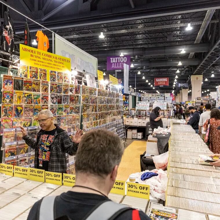 Ruben Miranda, 56, of New York City, N.Y., Salesman at the Absolute Comics & Statues, talks with guests as they look for comics at the 2024 Comic Book Fan Expo at the Pennsylvania Convention Center in Philadelphia on Friday, May 3, 2024.