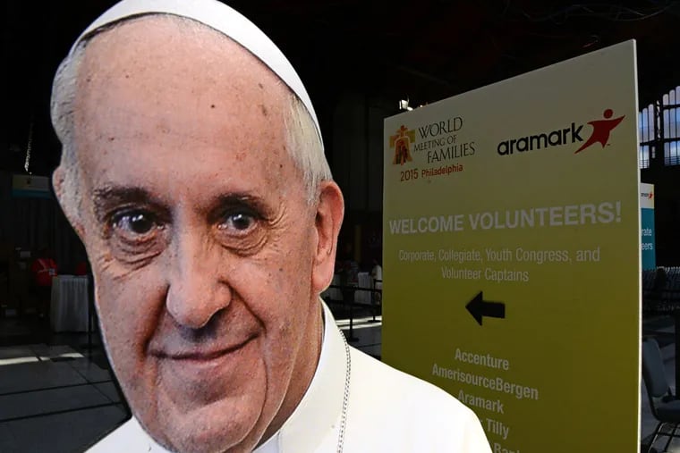 The now-ubiquitous cutout photo of Pope Francis greets volunteers arriving to register at the Convention Center September 20, 2015 as preparations continue for the World Meeting of Families. (TOM GRALISH/ Staff Photographer)