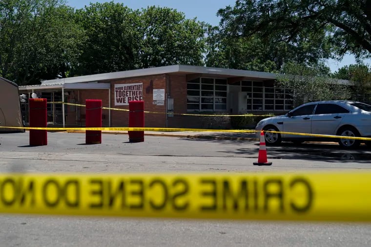 Crime scene tape surrounds Robb Elementary School in Uvalde, Texas.