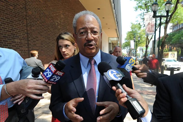 U.S. Rep. Chaka Fattah is swarmed by the media as he leaves the U.S. Federal Courthouse in Philadelphia on Aug. 18, 2015. (CLEM MURRAY/Staff Photographer)