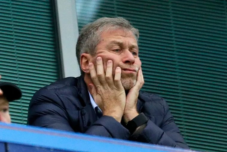 In this file photo dated Saturday, Dec. 19, 2015, Chelsea soccer club owner Roman Abramovich sat in his box before the English Premier League soccer match between Chelsea and Sunderland at Stamford Bridge stadium in London. (AP Photo/Matt Dunham, File)