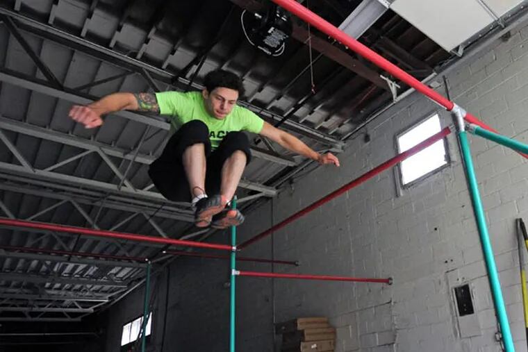 Jamie Rahn, an American Ninja Warrior contestant, at his Pinnacle Parkour Academy in Cherry Hill on Aug, 28, 2013.  ( APRIL SAUL / Staff )