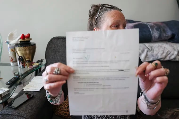 Donna Kuzowsky holds up a notice that was taped on her door last year in Mayfair. Philadelphia may lead the way with its Eviction Diversion Program, but tenants who are evicted illegally typically deal with landlord-tenant issues in the shadows.