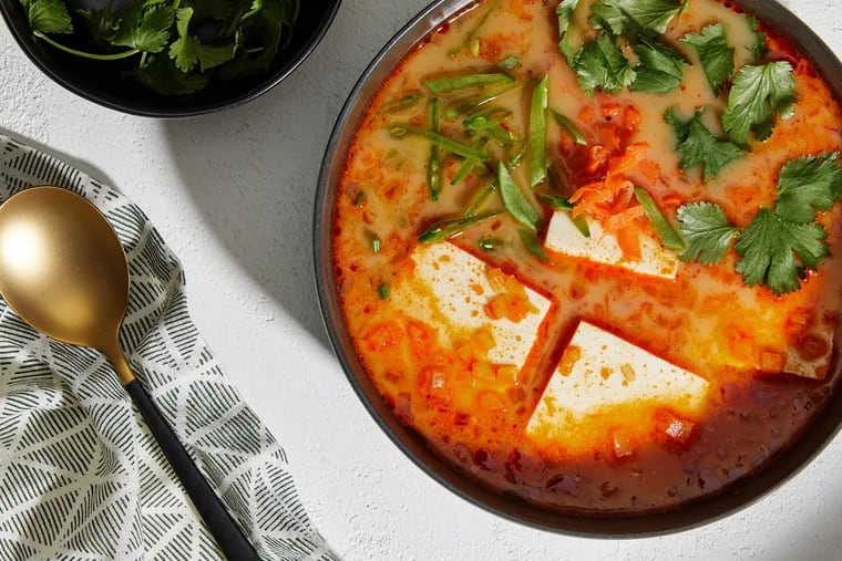 A bold Thai curry broth helps silken tofu unfurl its delicate charms.