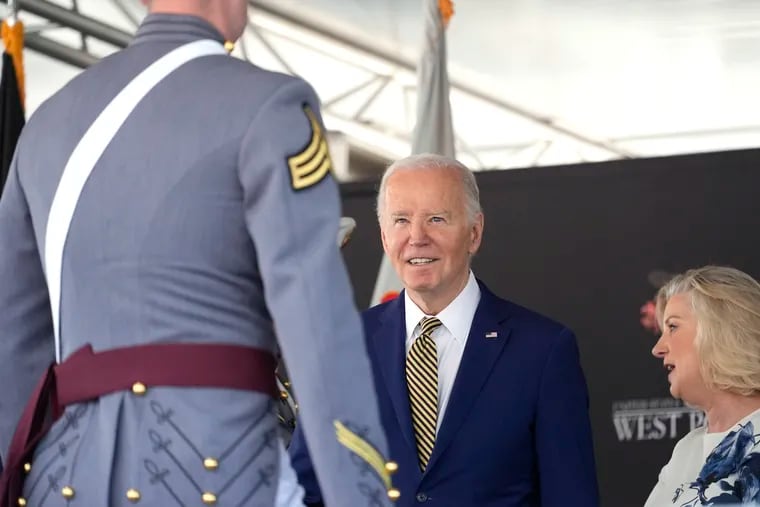 President Joe Biden presents diplomas to graduating cadets at the U.S. Military Academy commencement ceremony on Saturday in West Point, N.Y.
