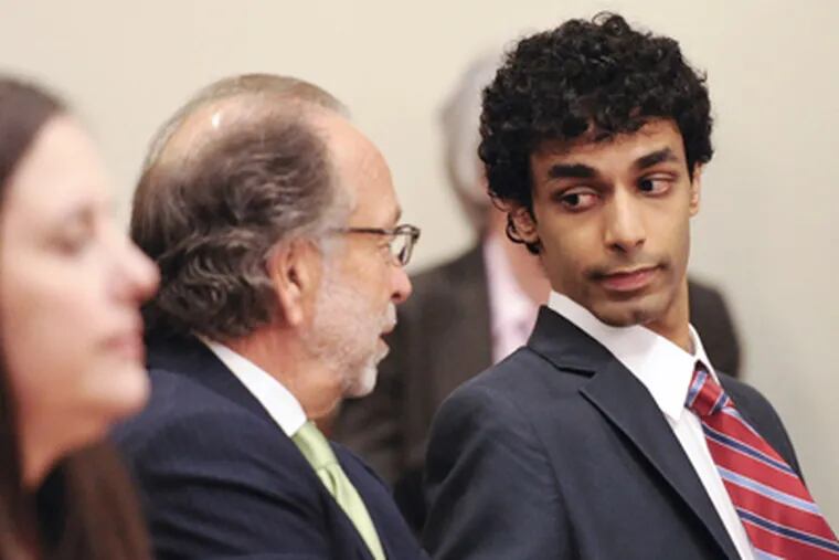 Dharun Ravi talking with attorney Steven Altman in court Monday before Altman entered a not-guilty plea in his case. (Ron Tarver / Staff Photographer)