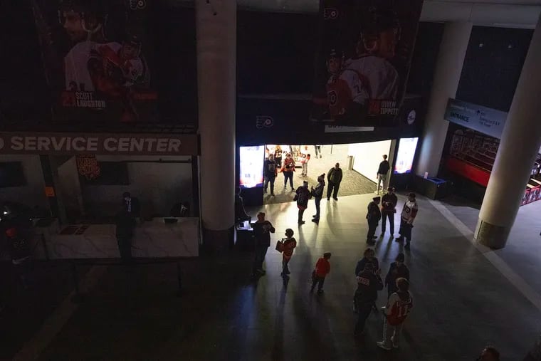 A partial power outage at the Wells Fargo Center at the Flyers and Lightning game during the 1st period on Feb. 27, 2024. The dark main concourse with only a store having power