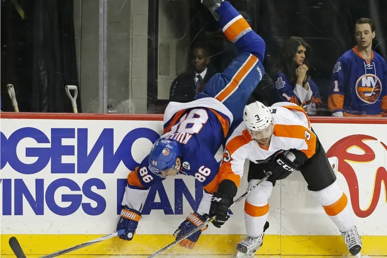 Islanders' Nikolay Kulemin is upended by Flyers' Radko Gudas in second period on Monday night.