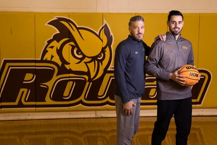 Eric Brennan (right) was named Rowan’s interim head basketball coach in April and his brother John, (left) who was an assistant at Neumann Goretti, joined him on staff. They are shown in Esbjornson Gymnasium on Dec. 12.