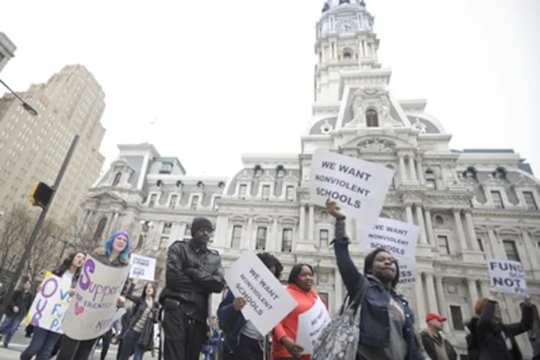 In a demonstration against violence, Philadelphia public school students and supporters marched past City Hall on March 30. 
<a href="http://www.philly.com/philly/news/special_packages/inquirer/school-violence/118812644.html"><b>An Inquirer investigative series has detailed the breadth of the problem.</b></a>  (Ron Tarver / Staff)