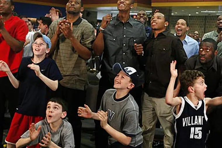 Villanova players and fans celebrate after learning they will stay in Philadelphia for the first two rounds of the NCAA Tourrnament. (Ron Cortes / Staff Photographer)