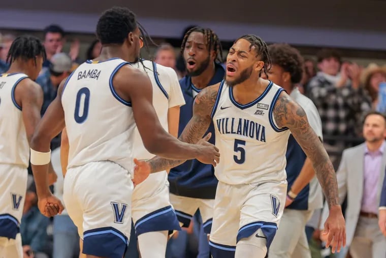 Villanova guard Justin Moore (right) suffered a knee injury in the game against Kansas State. The Wildcats face UCLA on Saturday at the Wells Fargo Center.