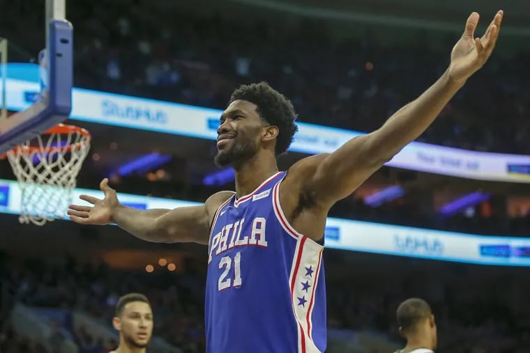 Sixers center Joel Embiid celebrates after getting fouled and making a basket about a minute after he baited Utah guard Donovan Mitchell into a technical foul on Monday night.  YONG KIM / Staff Photographer.