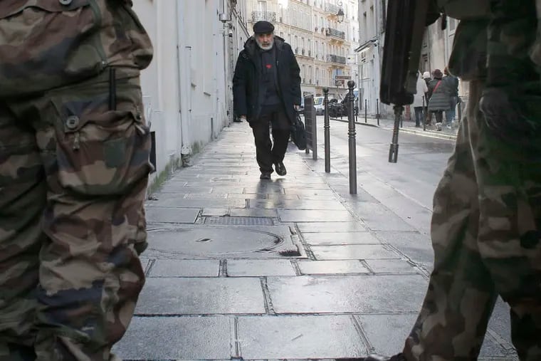 France ordered 10,000 troops into the streets Monday to protect sensitive sites - nearly half of them to guard Jewish schools.