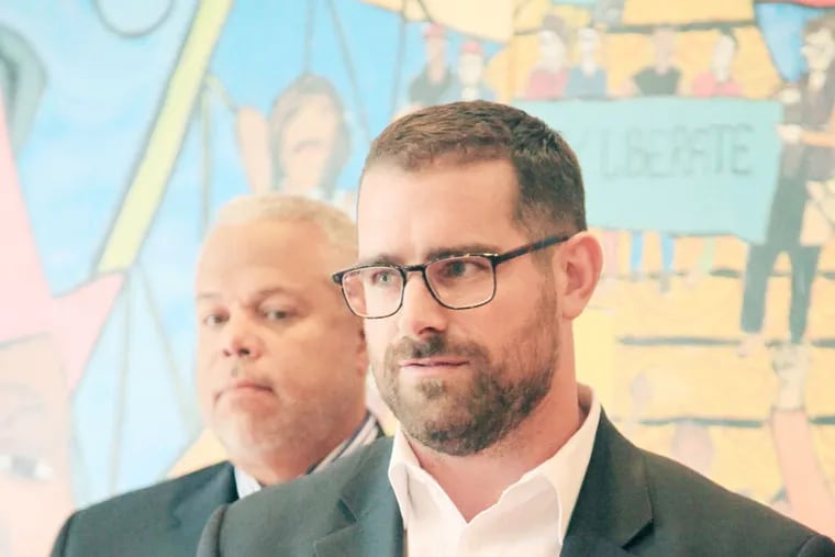 State Rep. Brian Sims, front right, and Sen. Anthony Williams, back left, Philly Democrats, announced plans to introduce a bill banning anti-gay conversion therapy for minors at the Attic Youth Center in Center City, Philadelphia, September 17th, 2013.  (Jad Sleiman / Daily News Staff)
