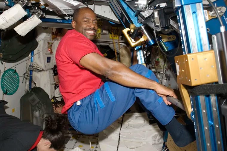 Astronaut Leland Melvin exercises in the Unity module of the International Space Station while the space shuttle Atlantis is docked with the station in November 2009.