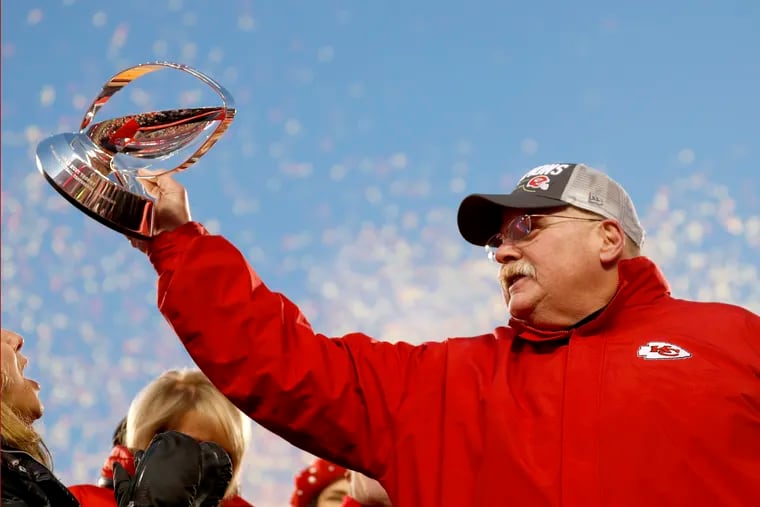 Chiefs head coach Andy Reid holds the Lamar Hunt Trophy after his team won the AFC championship on Sunday.