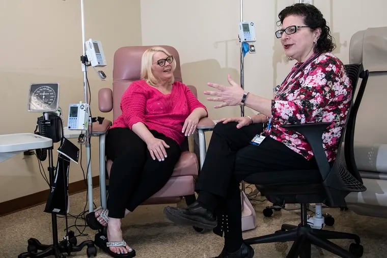 Patient, Lori Inselman, left, interacts with Janine Kyrillos, director of JeffersonÕs Comprehensive Weight Management Program during a consultation in Bala Cynwyd. Kyrillos has admitted Inselman to a closed Facebook Group of other people who were also struggling with weight issues.