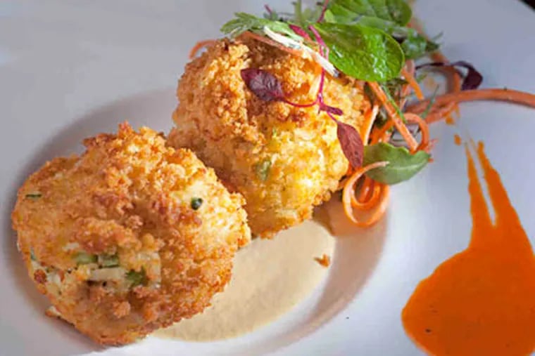 The outstanding crab cakes are one dish the Farmer’s Daughter can build on. (Ed Hille / Staff Photographer)