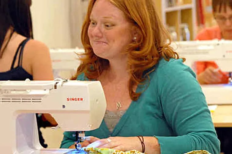 At Spool Sewing, a class of women, including Megan Flanagan of Hamilton, N.J., learn to sew homemade bags. (April Saul / Staff)