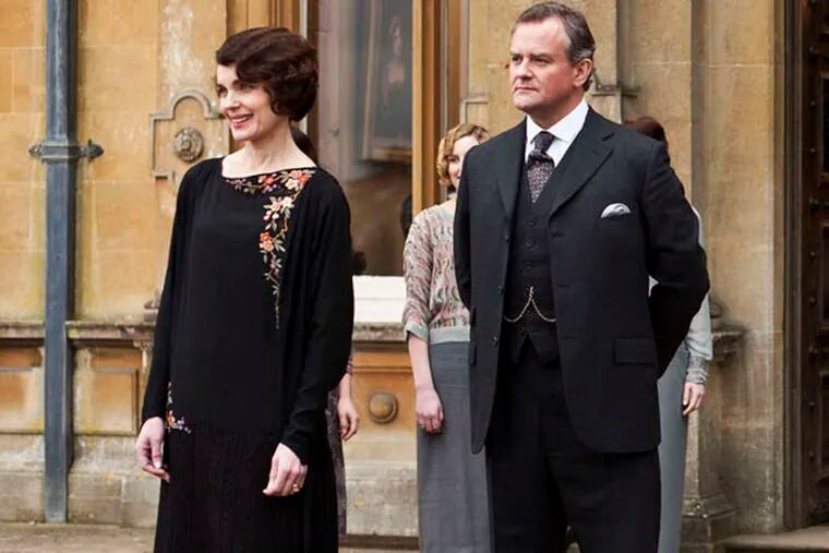 This undated publicity photo provided by PBS shows, from left, Elizabeth McGovern as Lady Grantham, Hugh Bonneville as Lord Grantham, Dan Stevens as Matthew Crawley, Penelope Wilton as Isobel Crawley, Allen Leech as Tom Branson, Jim Carter as Mr. Carson, and Phyllis Logan as Mrs. Hughes, from the TV series, "Downton Abbey."  The program was nominated for an Emmy Award for outstanding drama series on, Thursday July 18, 2013. The Academy of Television Arts & Sciences' Emmy ceremony will be hosted by Neil Patrick Harris. It will air Sept. 22 on CBS. (AP Photo/PBS, Carnival Film & Television Limited 2012 for MASTERPIECE, Nick Briggs)