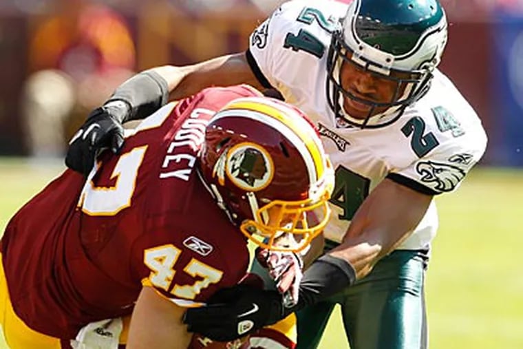 Redskins tight end Chris Cooley exited the game after this hit by Eagles corner Nnamdi Asomugha. (Ron Cortes/Staff Photographer)