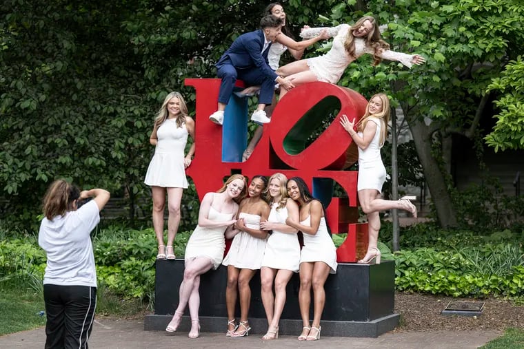 University of Pennsylvania women's NCAA college soccer players pose for a pre-graduation photo at the Love Statue on the school campus, in Philadelphia.