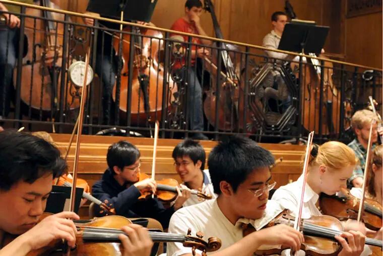 Members of the Curtis Symphony Orchestra rehearse inside the cramped (basses on the balcony) Field Concert Hall April 6, 2011 for their final concert of the year
