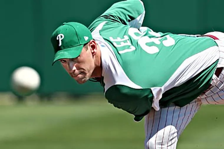 Cliff Lee and the Phillies wore green uniforms for St. Patrick's Day on Thursday. (David M Warren/Staff Photographer)