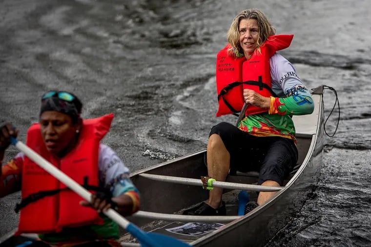 Judy Perkins, right, paddles during a team canoe race in Wilton Manors, Fla. Perkins has undergone an experimental breast cancer treatment and has seen successful results. 