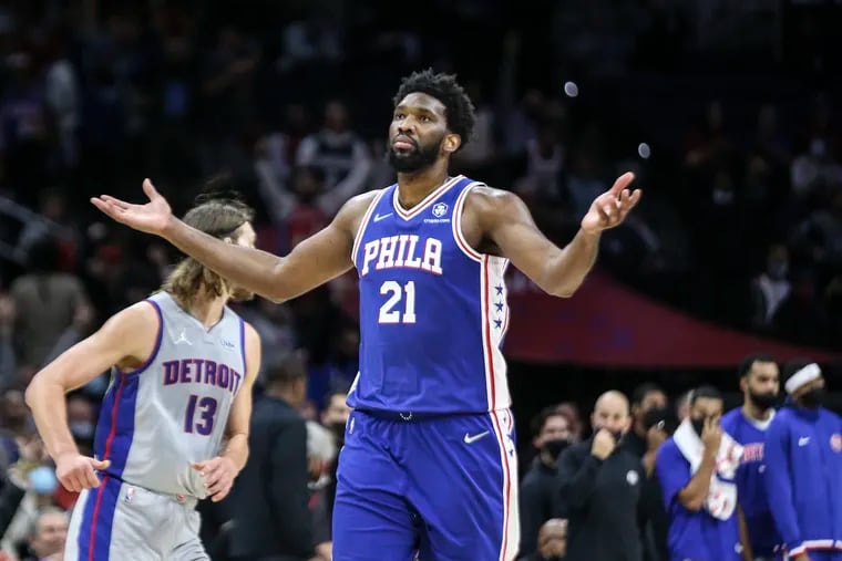 Sixers center Joel Embiid celebrates his three-pointer against the Pistons late during the fourth quarter at the Wells Fargo Center.