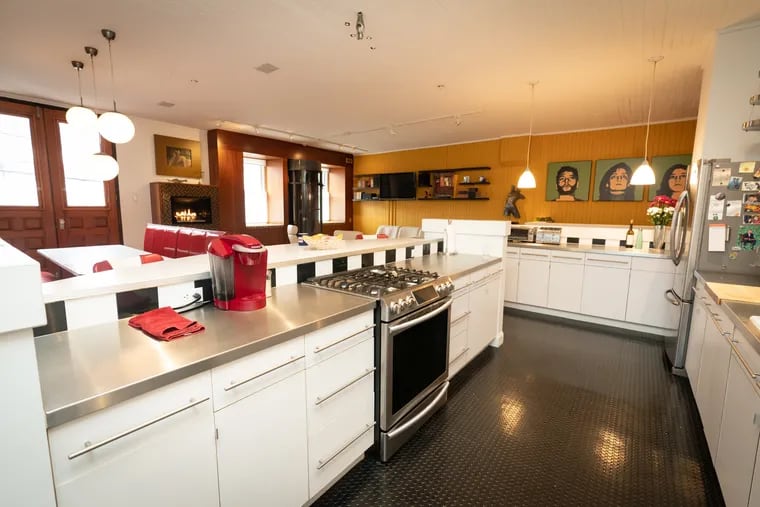 The kitchen area in a brownstone carriage house that was built in 1889 on a grand scale for the enormous mansion nearby, and is the home of Andrew and Holly Kleeman, in Philadelphia, Friday, January 26, 2024.