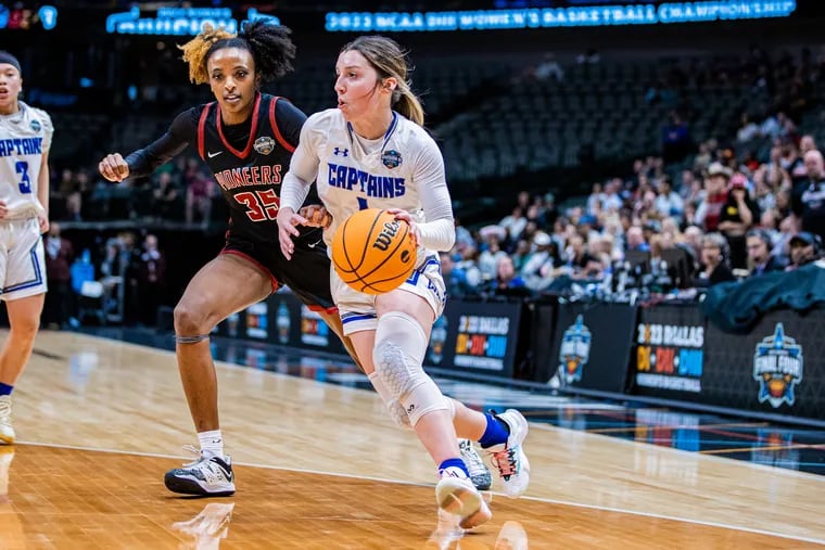 Lauren Fortescue (right), a Plymouth Whitemarsh alumna, drives toward the basket during Christopher Newport's NCAA Division III championship game against Transylvania on April 1 in Dallas.