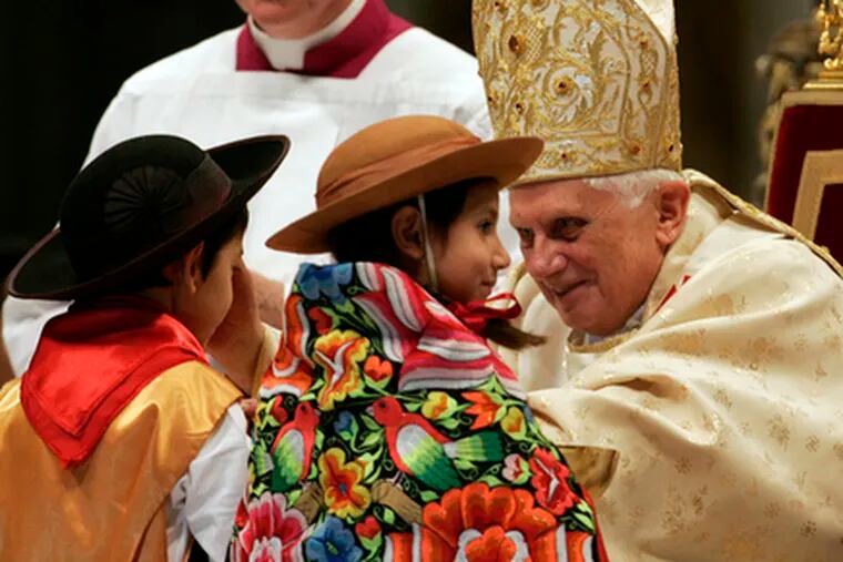 Pope Benedict XVI blesses children as he celebrates the Christmas Midnight Mass in St. Peter&#0039;s Basilica.