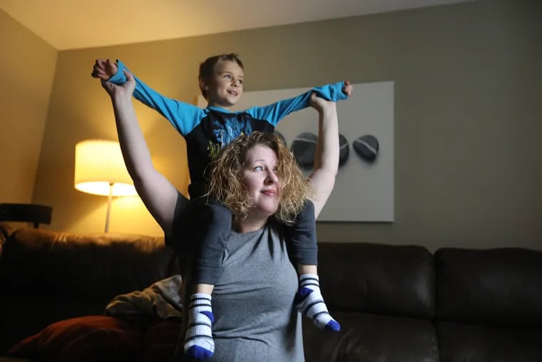 Nichole and Matthew Lowther play in their living room. Nichole wasn't diagnosed with autism until her son Matthew, now 6, was diagnosed a few years ago.
