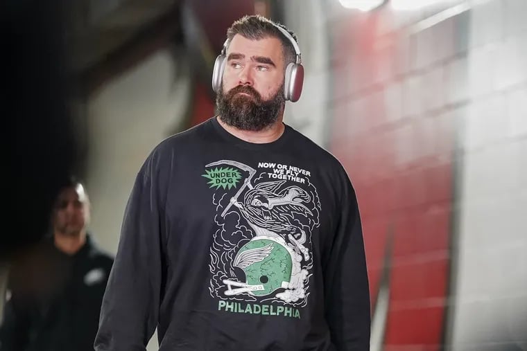 Jason Kelce wears a shirt designed by Collingswood artist Heavy Slime for Underdog Apparel while walking into Raymond James Stadium on Monday for the game against Tampa Bay. After the Eagles lost, Kelce told teammates that he planned to retire, sources said.